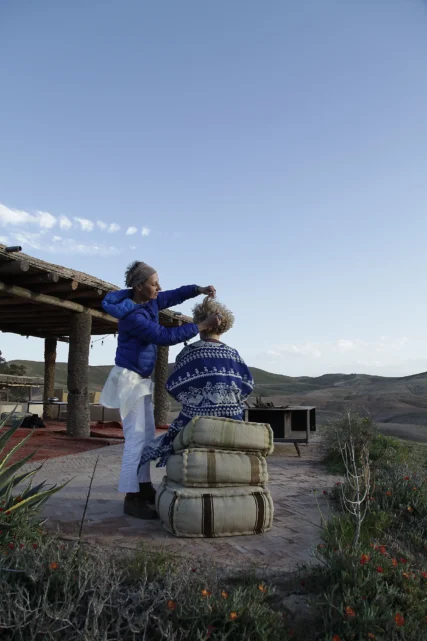 Blandine Lagoutte styling hair in the Agafay desert, Marrakech