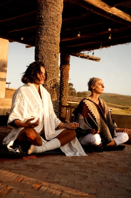 Meditation on a terrace at sunset