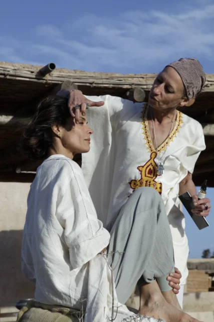 Blandine performing a nourishing hair oil ritual